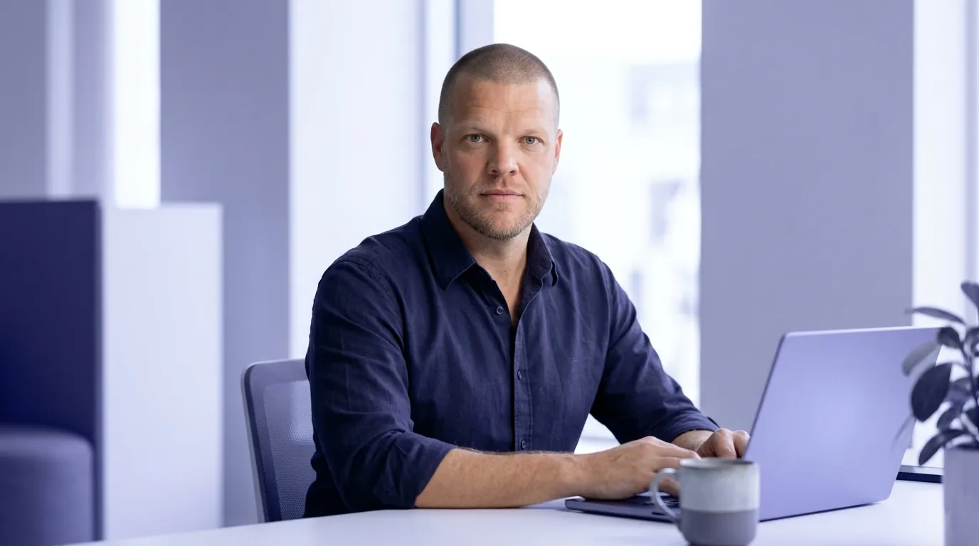 Mike Moore, founder of Strategic AI Architects, at a laptop showing a structured data test result flagging a review snippet as not eligible, with greyed out star icons